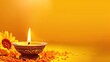 © vstudio - happy diwali traditional diya oil lamp with vibrant orange marigold flowers decoration festive yellow background copy space hindu culture