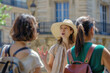 © Ekaterina Pokrovsky - Young female tourist guide showing European city to the group of tourists