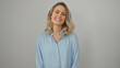 © Krakenimages.com - Smiling young adult caucasian woman with blonde hair in a casual blue shirt, isolated against a white background