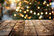 © Rabia - Empty wooden table in front of christmas tree. Space for text