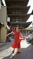 Poster - Spinning around in joy, a beautiful hispanic woman unveils her dress on the ancient streets of gion, kyoto, her radiant smile adding charm to this mesmerizing japanese old town.