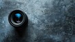 © AkuAku - Camera lens on gray table before service work Flatlay with empty space