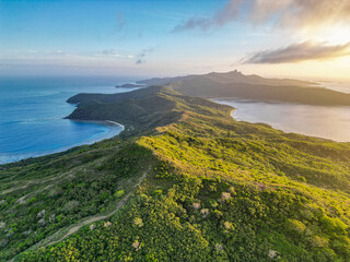 Wall Mural - aerial view of tropical islands in fiji at sunrise. remote untouched dense forest covers the long th