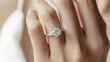 © Matcha_09 - Luxurious diamond ring on an elegant woman's ring finger, set against a clean background for business promotions