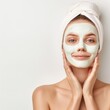 © Exnoi - A woman in a half-body view, with visible arms, applying an organic face mask made from natural ingredients. The background is isolated on a white background.