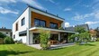 © sambath - Modern house with integrated photovoltaic panels on the roof.