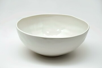 Canvas Print - Simple, elegant white porcelain bowl isolated on a white background, suitable for various uses