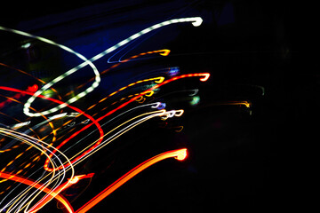 Wall Mural - a series of colorful streaks in the air, with the colors red, yellow, and blue. the streaks are movi