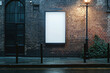 © Carmen - Blank white vertical poster mock up on side of brick building with lamp post and sidewalk, copy space