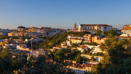 Wall Mural - Aerial view of Lisbon cityscape, budlings with red roofs in Portugal, during sunset, the second-oldest European capital city