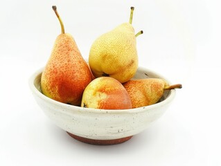 Pearfectly Ripe: A Stunning Bowl of Pears on a White Background