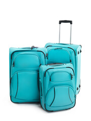 Wall Mural - Three turquoise blue Suitcases isolated on white background