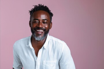 Wall Mural - A smiling black man with beard and white shirt.