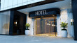 © Luluraschi - Contemporary luxury hotel Exterior with 'HOTEL' signage, five stars hotel entrance facade