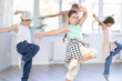 © JackF - Positive girls and boys training hip hop in dance studio, dance classes for kids