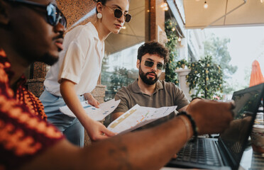 Sticker - Diverse businesspeople collaborating outdoors, reviewing documents and laptop, working together in a casual setting. Teamwork and communication depicted through discussion and sharing ideas.