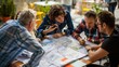 © Ariep - Team of Architects Collaborating on a Blueprint