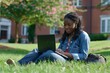 © Amni - Young Woman Working on Laptop in Park
