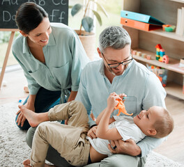 Wall Mural - Family, child and play with toy dinosaur or hug for bonding, teaching and learning of animals history in living room. Parents, boy and embrace with communication for plastic reptiles, game and house