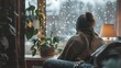 © Super - A cozy indoor scene with a person wrapped in a blanket, watching the rain through the window, warm and comforting