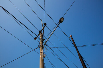 Power pole photo with dangling wire. Power pole cable