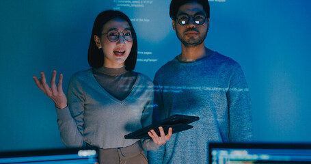Group adult Asia male female software developers mentor leader manager talk strategy plan to executive write prompt AI bot IT app program nomad, video game, data center. Projecting slideshow code.