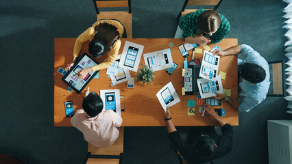 Top view of developer and designer shake hand together at meeting. Software developer handshake and working together with programmer to develop Ux Ui desifn for mobile phone interface. Convocation.