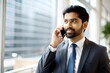 © N7 - 'Indian Executive in a Suit Making a Phone Call in Office' – A business executive engaged in a phone conversation.