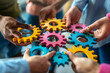 © Ikhou - group of multiethnic business people connecting colorful gears with their hands