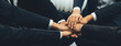 © Summit Art Creations - Office worker team stacking hand together symbolize successful group of business partnership and strong collective unity teamwork in community workplace in panoramic banner. Shrewd