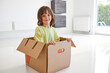 © Westend61 - Cute boy in cardboard box at new apartment