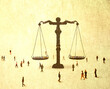 © Westend61 - Illustration of oversized scales of justice surrounded by people