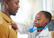 © Fanti/peopleimages.com - Father, kid and playing doctor with costume or healthcare toys for bonding, pretend or cardiology at home. Black family, dad and child listening to heart beat for nursing game, checkup or career day