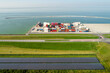© Westend61 - Aerial view of solar farm and cargo containers on harbour near sea in Netherlands