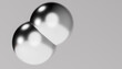 © Westend61 - 3d rendering of shiny metallic balls against gray background