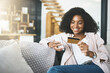 © JordaanExams/peopleimages.com - Woman, card and smartphone and relaxing on sofa, fintech and transaction for online shopping in home. Customer, internet payment and sale app or banking, ecommerce and smile or purchase in apartment