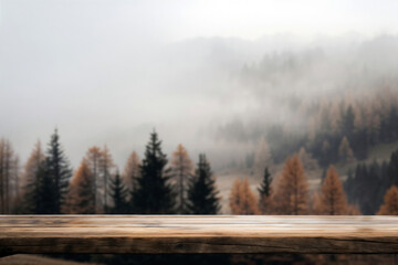 Naklejka na meble Empty wooden table is displaying a foggy autumn forest landscape with evergreen and larch trees