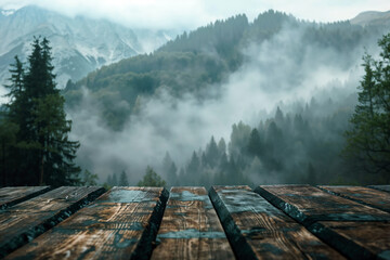 Poster - Empty wooden tabletop overlooking misty mountain forest in the background