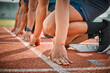 © DavisShared/peopleimages.com - Race, start and hands of men on track at arena for speed challenge, marathon event and sports. Ready, set and group of people at competition lines for fitness, exercise and running athlete at stadium