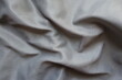 © Anna - Soft folds on simple unprinted grey polyamide fabric