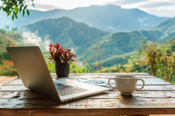 workspace with laptop and coffee on wooden table with nature mountain background, freelance worker.
