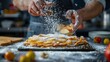 © Sirichat. Camphol - Chef's hands prepare crispy apple fruit tart. Dessert strudel over rustic kitchen background with powdered icing sugar and fruit.