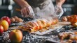 © Sirichat. Camphol - Chef's hands prepare crispy apple fruit tart. Dessert strudel over rustic kitchen background with powdered icing sugar and fruit.