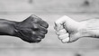 © NE97 - Image of a fist bump of solidarity, representing teamwork, cooperation, and partnership. Can be used for business, sports, or friendship-related concepts.