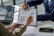 © mojo_cp - Businesspeople analyze investment on marketing data, Teamwork discussing in meeting