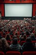 © pornsawan - People in the cinema auditorium with Cinema blank wide screen and red chairs in the cinema hall,People silhouettes watching movie performance,empty white screen,space for text.
