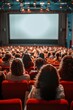 © pornsawan - People in the cinema auditorium with Cinema blank wide screen and red chairs in the cinema hall,People silhouettes watching movie performance,empty white screen,space for text.