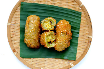 Canvas Print - Deep-fried banana rolls with unripe rice grain