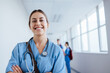 © Jacob Lund - Caucasian healthcare student standing in a hospital during training, wearing scrubs and a stethoscope