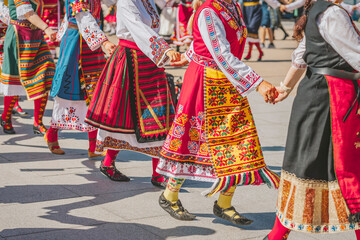 Bulgarian Women Performing Traditional Horo Dance In Colorful Costumes